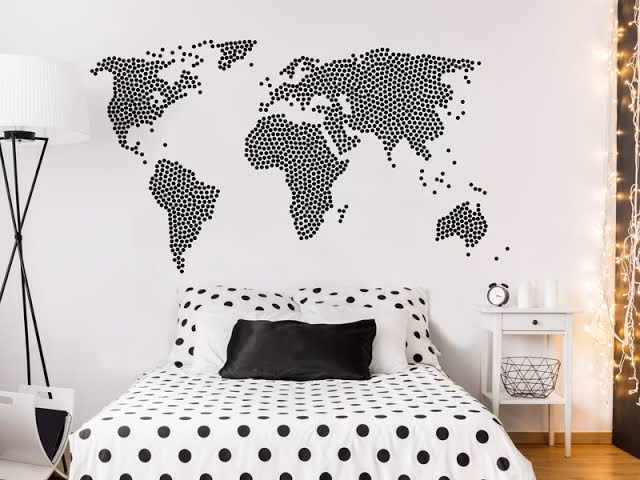 Black graphic stickers on a white wall