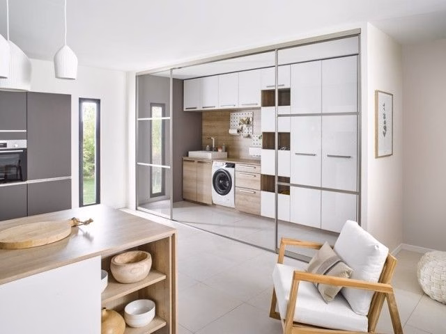 a laundry area integrated to the kitchen 