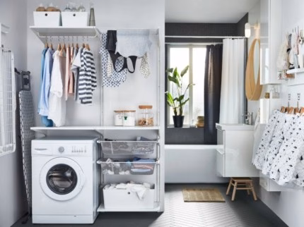 A laundry corner at the entrance of the bathroom