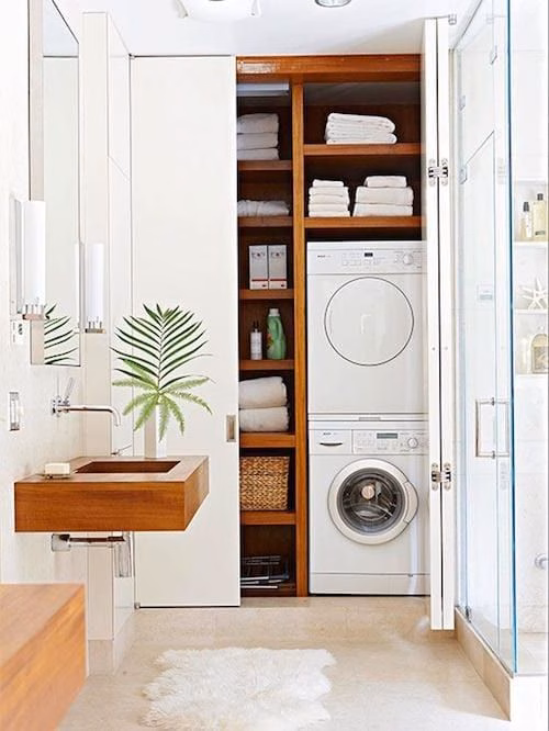a laundry room hidden in the closet 