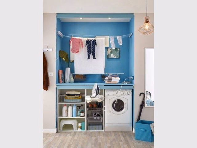 A laundry corner in the alcove of the bathroom