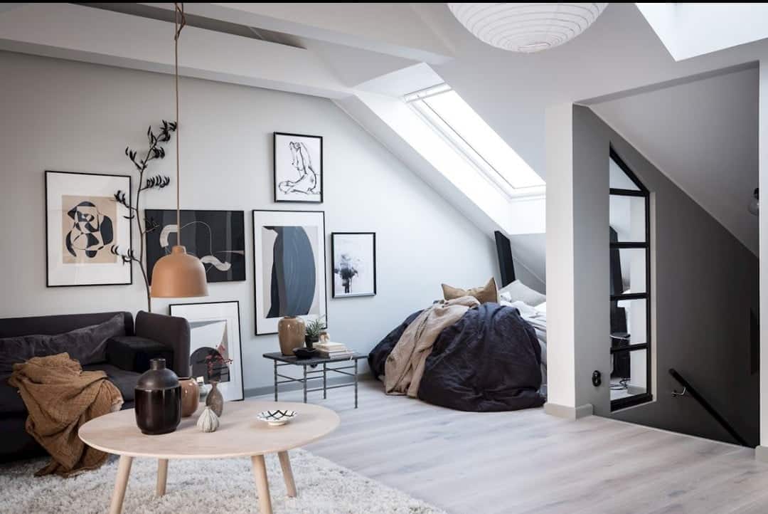 a big bedroom and living room in roof interior design