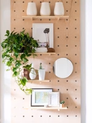 a pegboard to decorate an empty wall