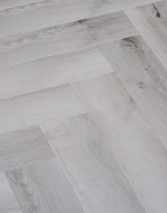 Gray and white washes herringbone wood flooring