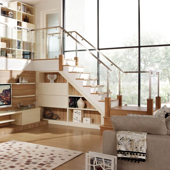 This gorgeous designer staircase combines glass with a brushed steel finish. Features include a square handrail and brushed steel clamps.