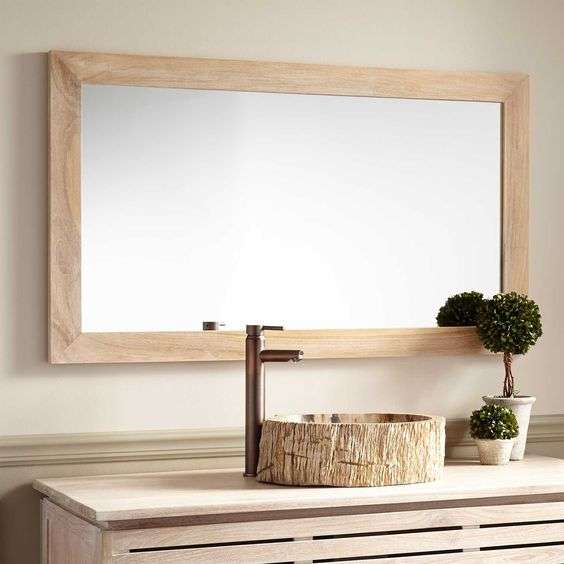 rectangular bathroom mirror with a wooden frame