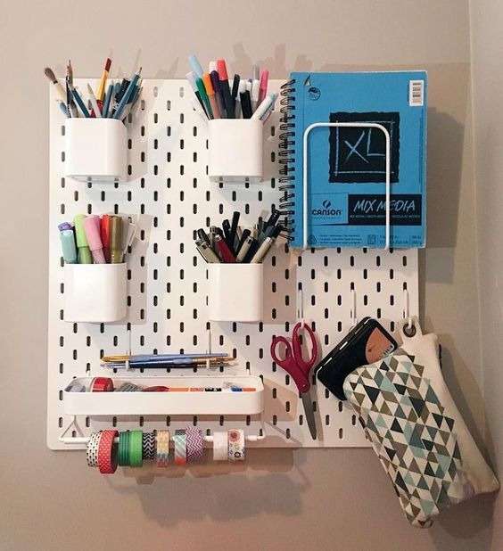 Use a perforated panel for vertical storage: 