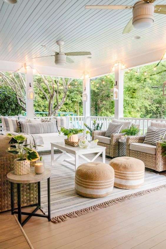 the Farmhouse Exterior with furniture and charming accents