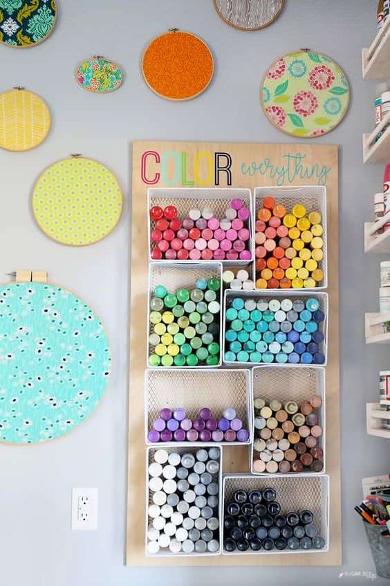 Glue bins to the wall for paint storage: 