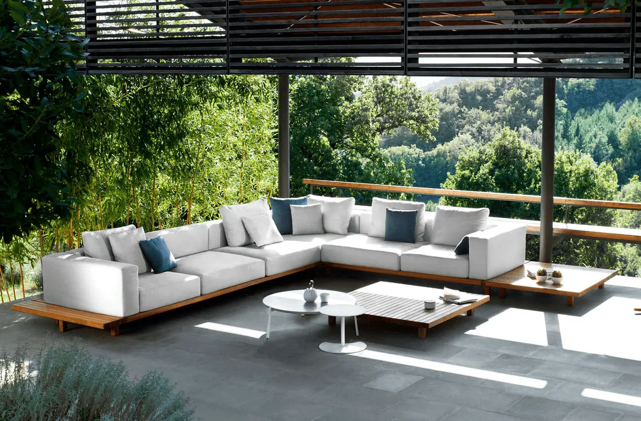 Modern outdoor lounge with greenery