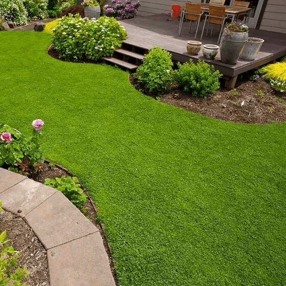 low maintenance landscaping around raised deck