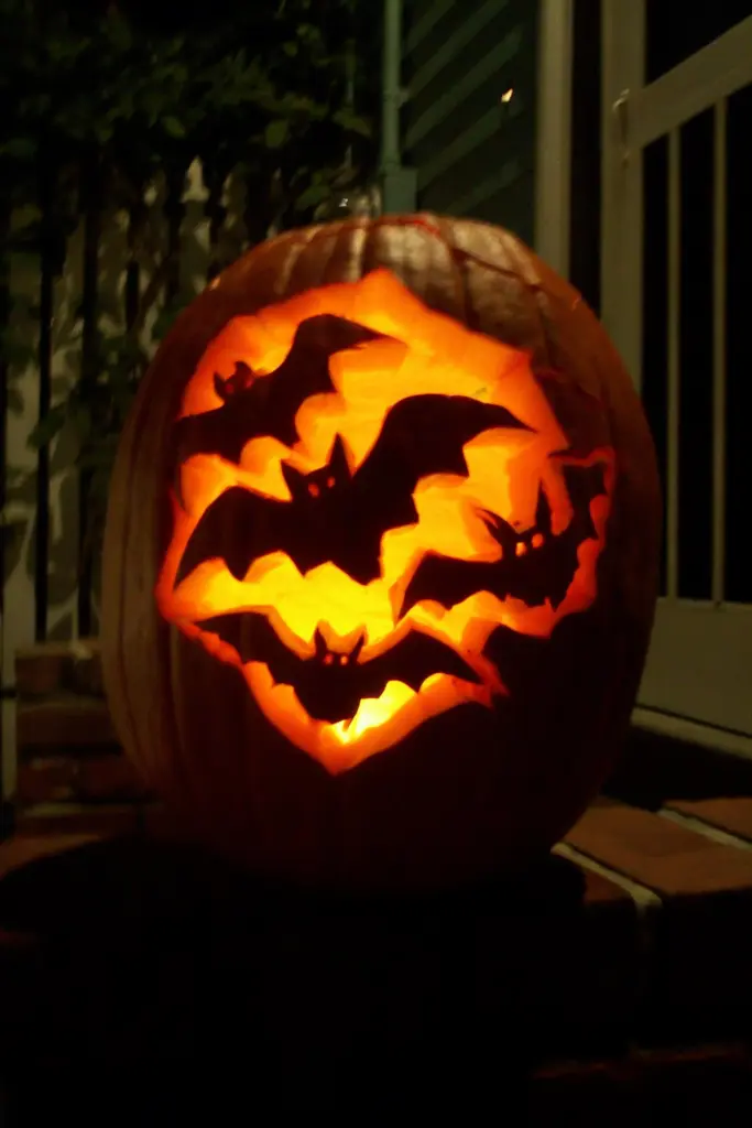 40+ Easy Pumpkin Carving Ideas for Fall & Holidays 18 Easy Pumpkin Carving with Bat Silhouette